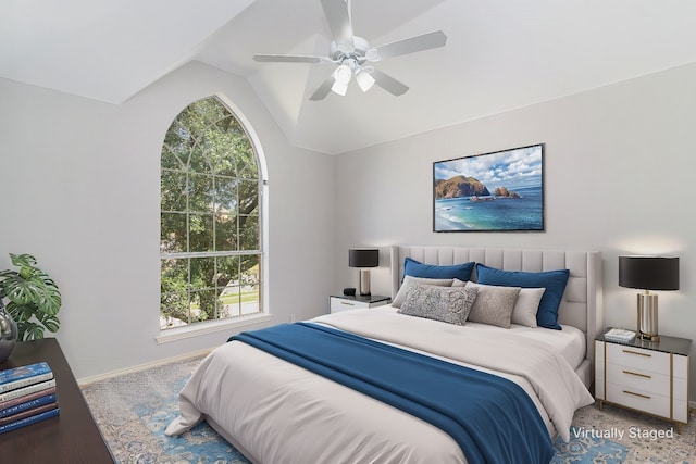 bedroom with carpet floors, ceiling fan, and lofted ceiling