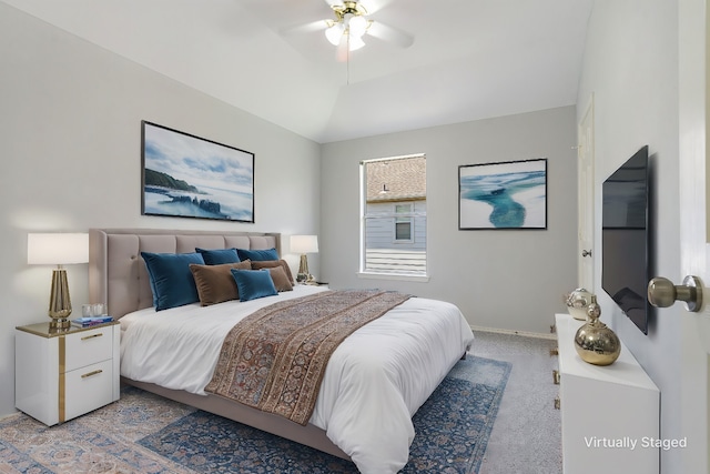 bedroom featuring ceiling fan, carpet, and lofted ceiling