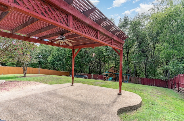 view of patio / terrace featuring a playground, a pergola, ceiling fan, and a trampoline