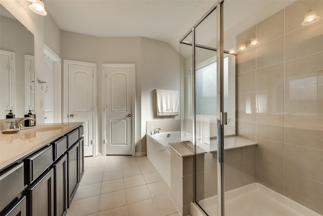 bathroom featuring tile patterned floors, separate shower and tub, and vanity