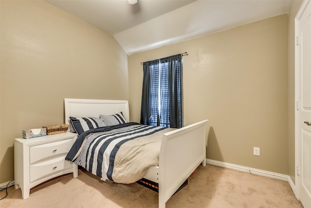 carpeted bedroom featuring vaulted ceiling