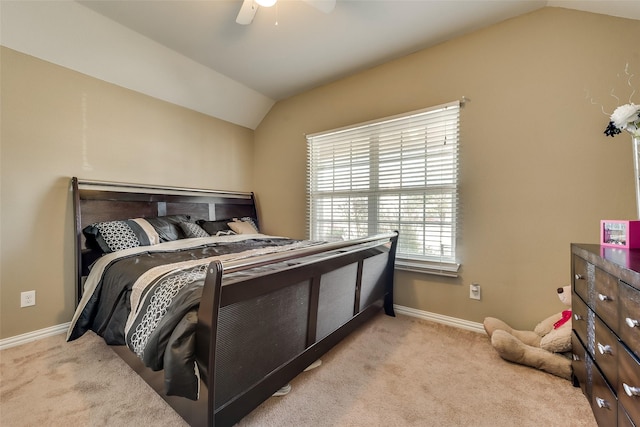 carpeted bedroom with ceiling fan and lofted ceiling