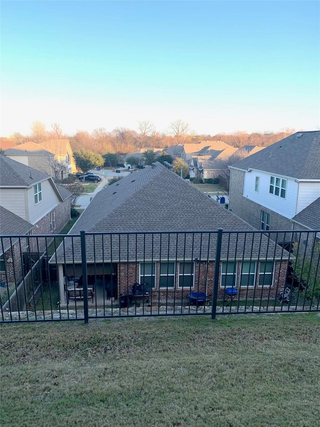 rear view of property featuring a yard