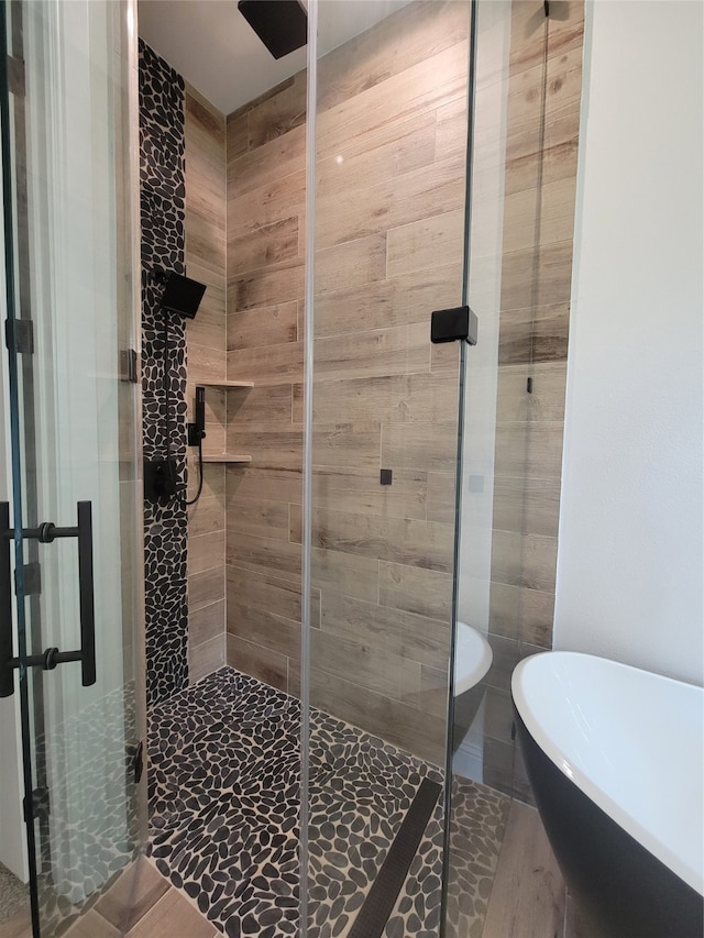 bathroom featuring plus walk in shower