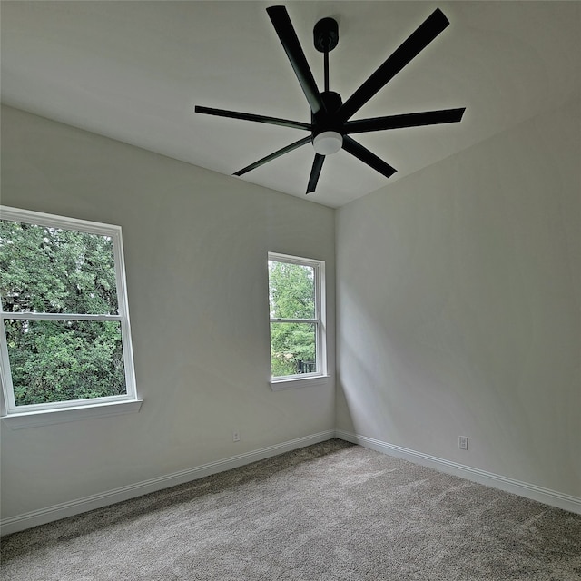 empty room featuring light carpet and ceiling fan