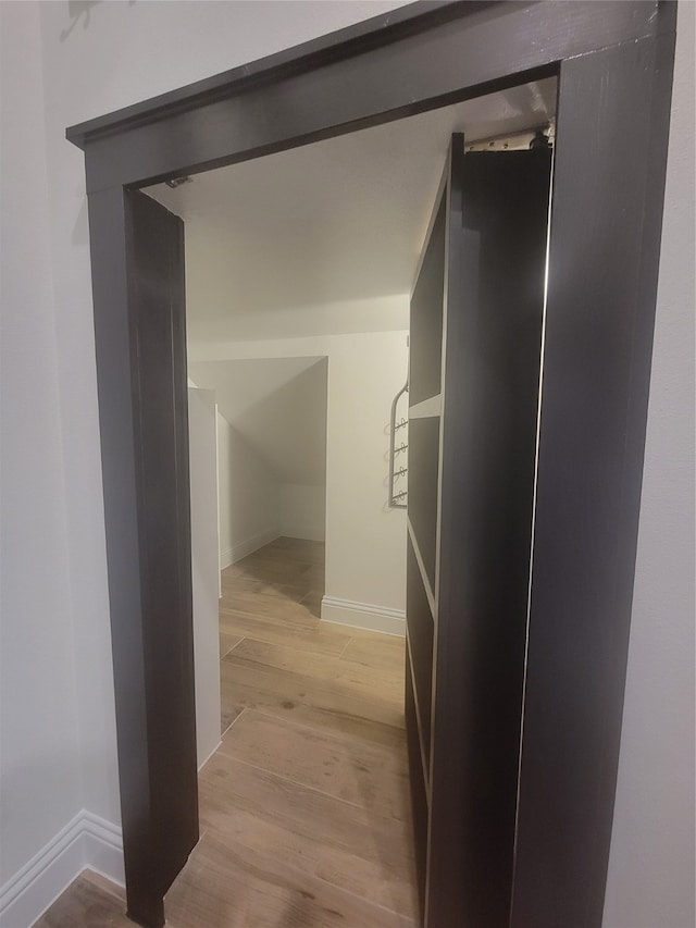 corridor featuring light hardwood / wood-style floors