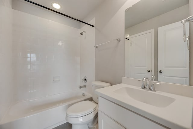 full bathroom featuring vanity, toilet, and tiled shower / bath