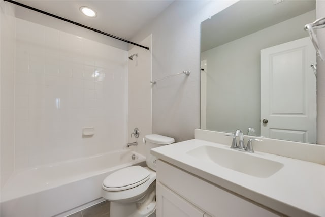 full bathroom featuring tile patterned flooring, vanity, toilet, and tiled shower / bath