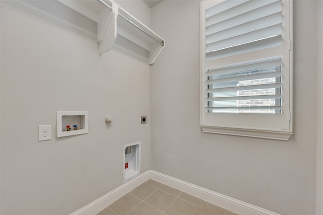 washroom featuring washer hookup, gas dryer hookup, light tile patterned floors, and hookup for an electric dryer