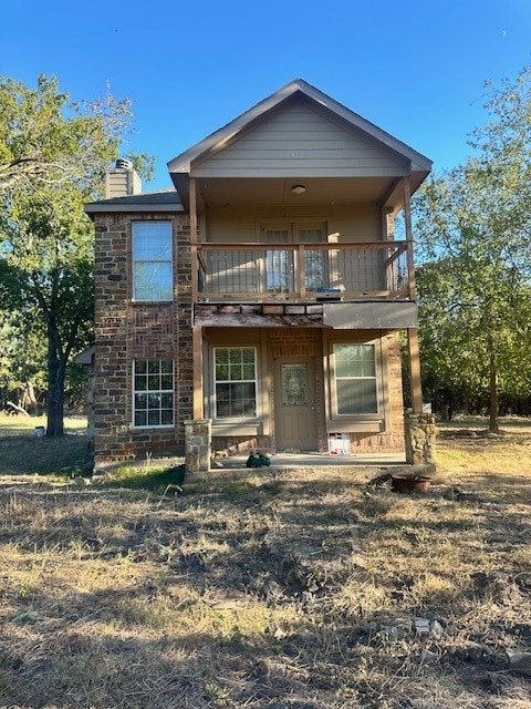 rear view of house with a balcony