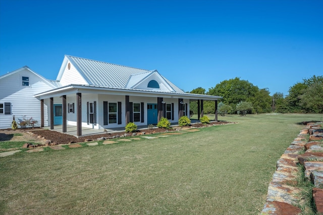 farmhouse with a front yard and covered porch