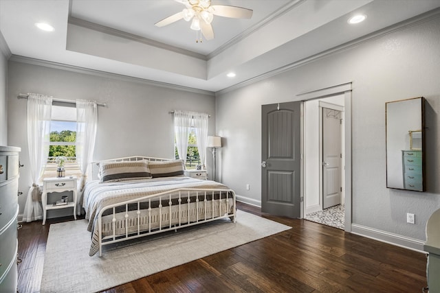 bedroom featuring dark hardwood / wood-style floors, ceiling fan, multiple windows, and crown molding