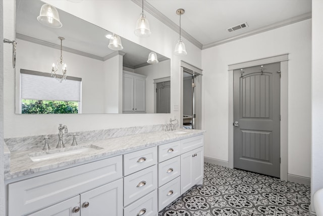 bathroom featuring ornamental molding, vanity, and a chandelier