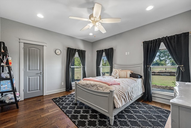 bedroom with dark wood-type flooring and ceiling fan