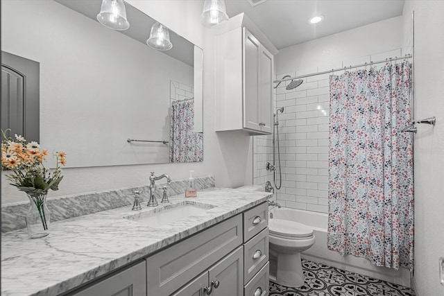 full bathroom with vanity, toilet, and shower / tub combo