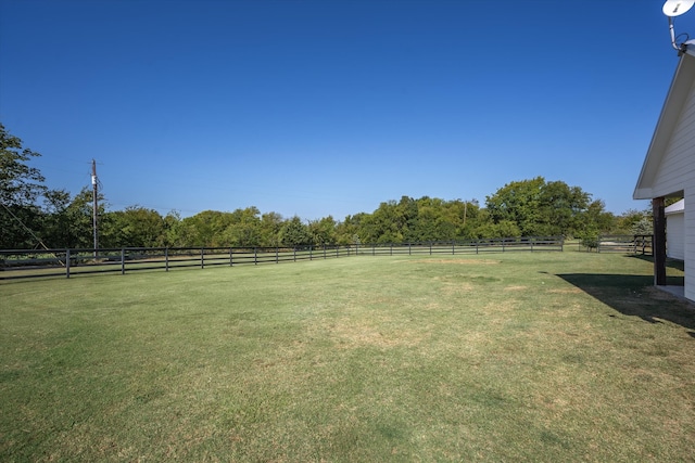 view of yard with a rural view