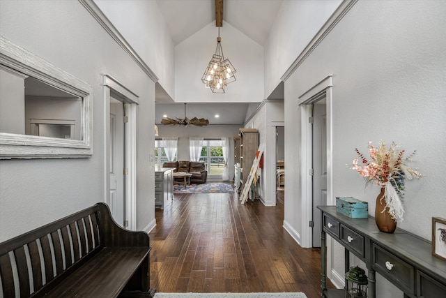 hall with dark wood-type flooring and vaulted ceiling with beams