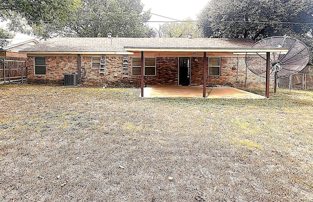 3504 Westfield Ave, Fort Worth, TX 76133 - back of house with a patio, central AC, a fenced backyard, brick siding, and roof with shingles