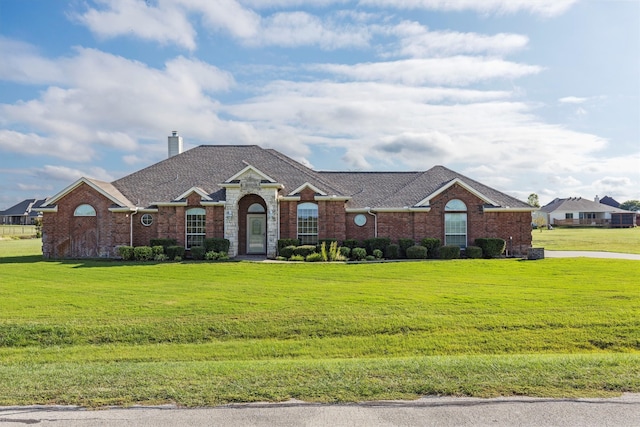 ranch-style house with a front yard