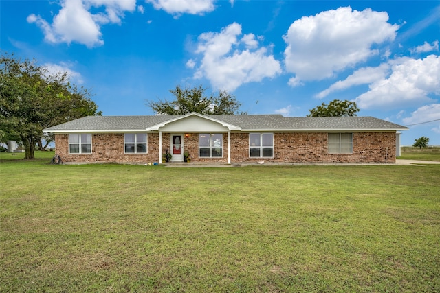 single story home featuring a front yard