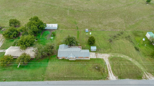 birds eye view of property featuring a rural view