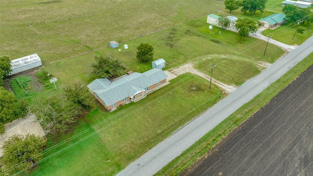 birds eye view of property with a rural view