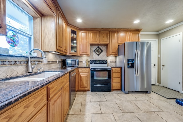 kitchen with stainless steel appliances, crown molding, sink, and decorative backsplash