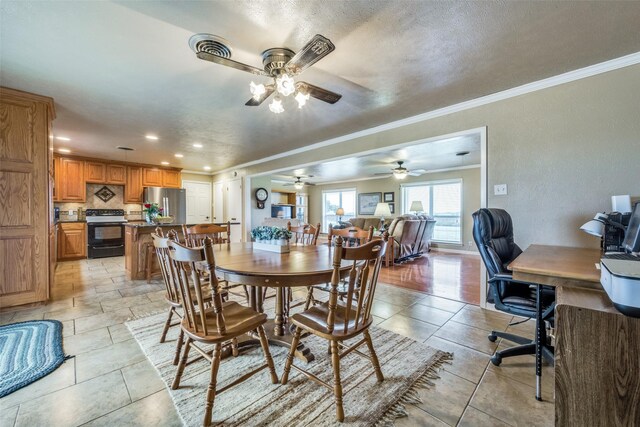3396 County Road 302, Muenster, TX 76252 - dining area with crown molding, a ceiling fan, and recessed lighting