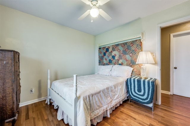 bedroom featuring ceiling fan and hardwood / wood-style flooring