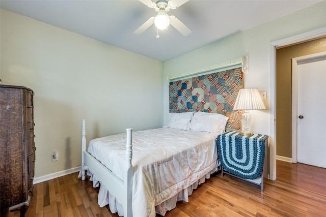 3396 County Road 302, Muenster, TX 76252 - bedroom featuring baseboards, ceiling fan, and wood finished floors