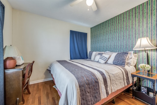 bedroom featuring wood-type flooring and ceiling fan