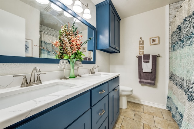 bathroom featuring vanity, toilet, and a shower with shower curtain