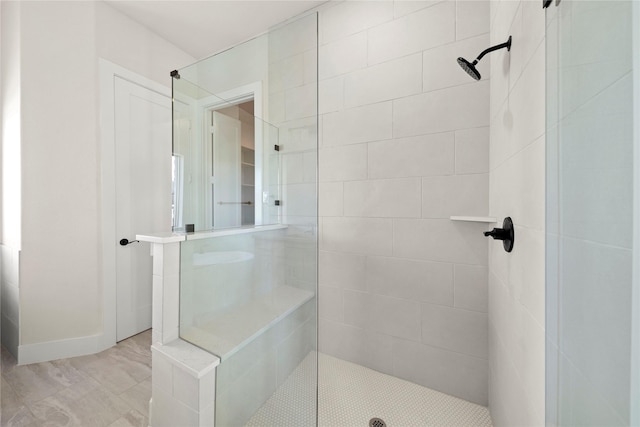 full bath featuring a tile shower