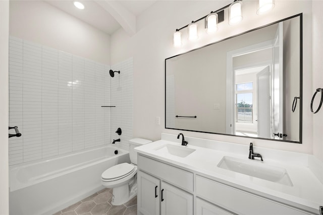 full bathroom with tiled shower / bath, vanity, toilet, and tile patterned flooring