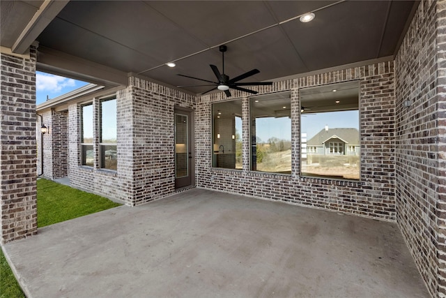 view of patio featuring ceiling fan