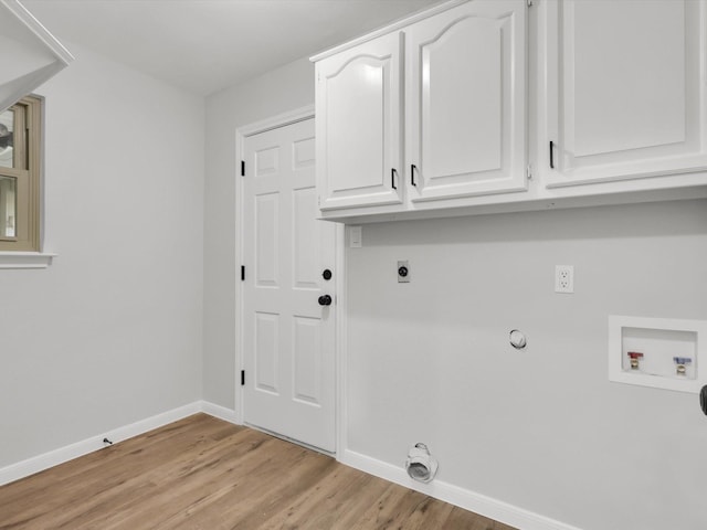 washroom featuring hookup for an electric dryer, light hardwood / wood-style floors, cabinets, and hookup for a washing machine