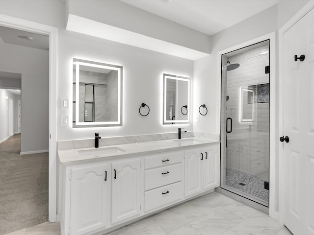 bathroom with vanity and a shower with shower door