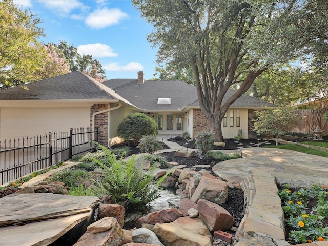 back of house featuring a garage