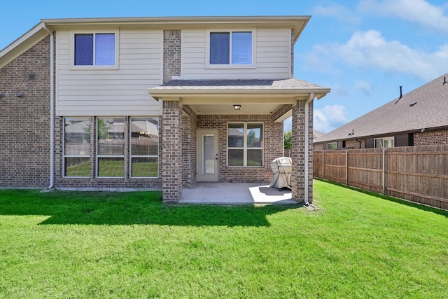 1104 Dove Haven Dr, Mansfield, TX 76063 - back of property featuring fence, a yard, a patio area, and brick siding