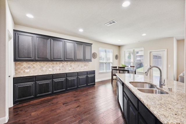 1104 Dove Haven Dr, Mansfield, TX 76063 - kitchen featuring backsplash, light stone countertops, a sink, and dark wood-type flooring