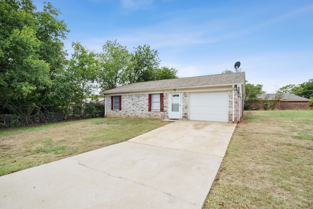 view of front of home featuring a front lawn and a garage