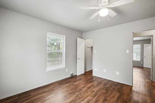 interior space featuring ceiling fan and dark hardwood / wood-style flooring