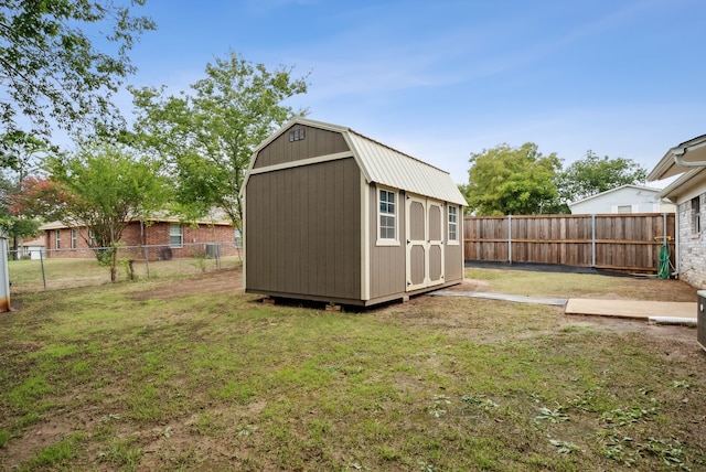 view of outdoor structure featuring a lawn