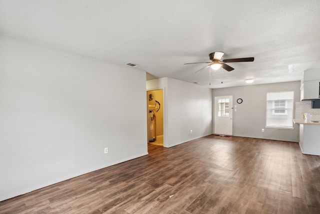 unfurnished living room with hardwood / wood-style floors and ceiling fan