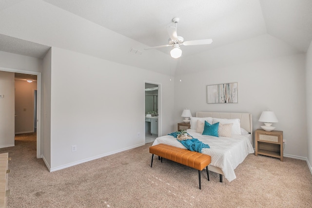 bedroom with light carpet, ensuite bath, lofted ceiling, and ceiling fan