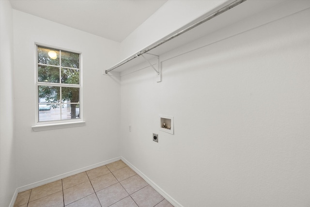 laundry room with hookup for a washing machine, light tile patterned floors, and hookup for an electric dryer