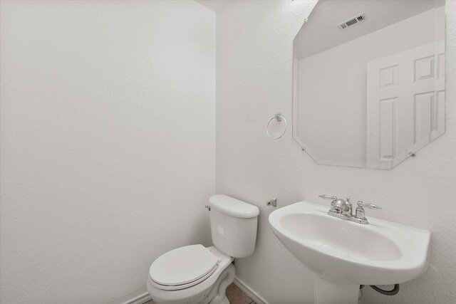 bathroom with toilet and sink