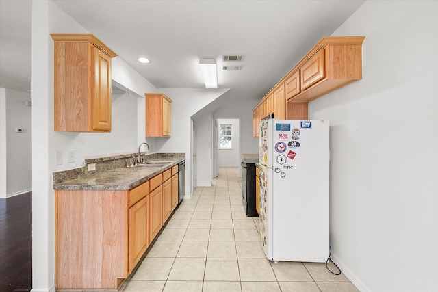 kitchen featuring light brown cabinets, light tile patterned floors, sink, stainless steel dishwasher, and white fridge