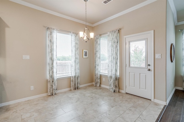 foyer featuring ornamental molding, an inviting chandelier, and a healthy amount of sunlight