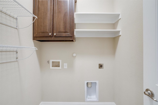 laundry area with hookup for a gas dryer, hookup for an electric dryer, washer hookup, and cabinets